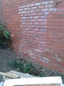 The windows and lintels chalked on the wall